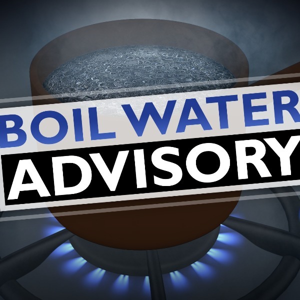 pot of boiling water with boil water advisory text