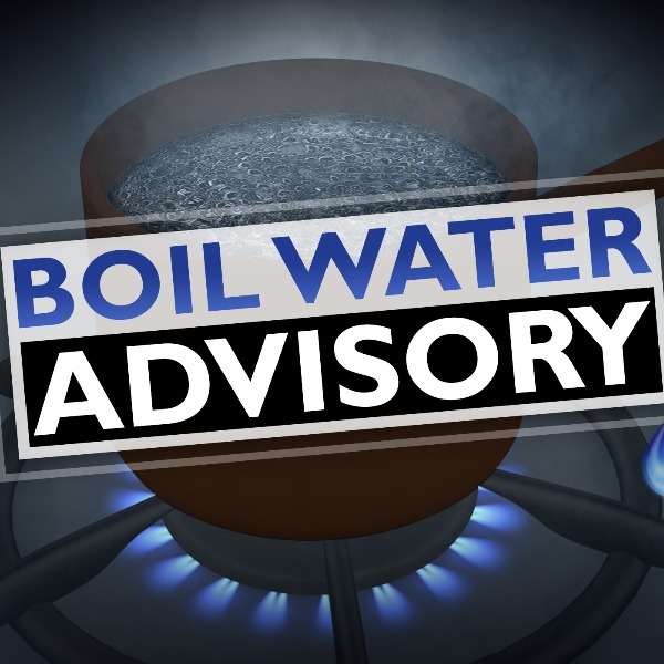 boil water advisory text in front of clipart of pot boiling water