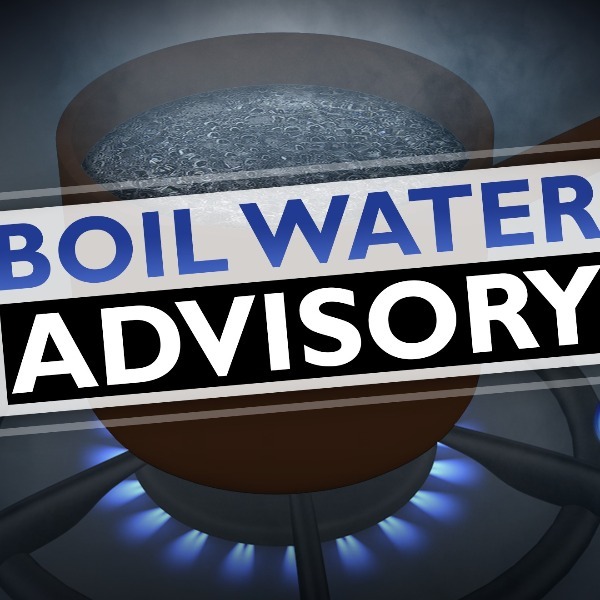 boil water advisory text in front of clipart of pot boiling water